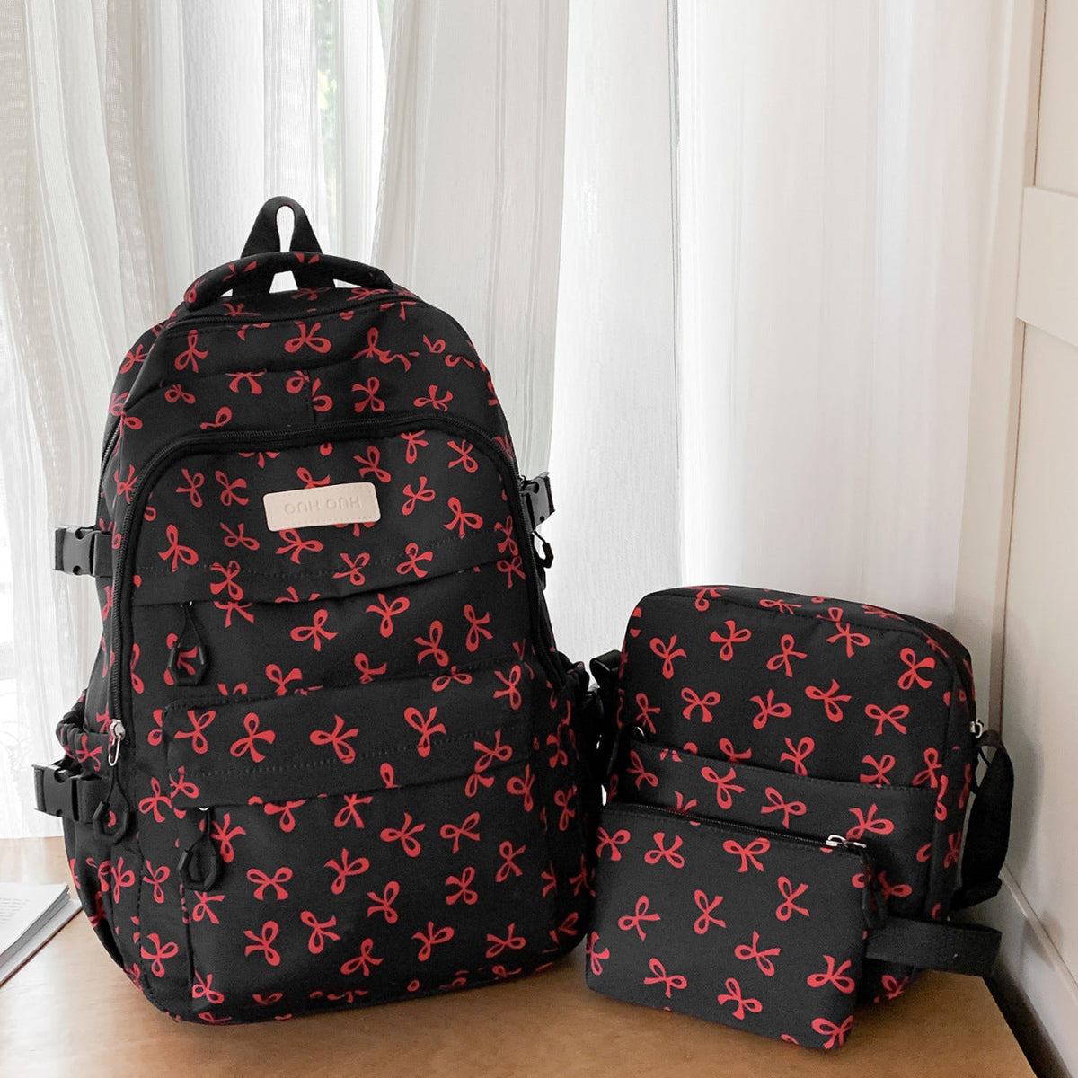 Bow Print Backpack with Multiple Pockets and Padded Shoulder Straps