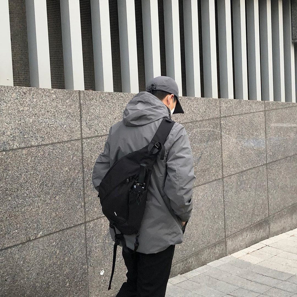 Sling Backpack with Multiple Compartments and Zipped Pockets