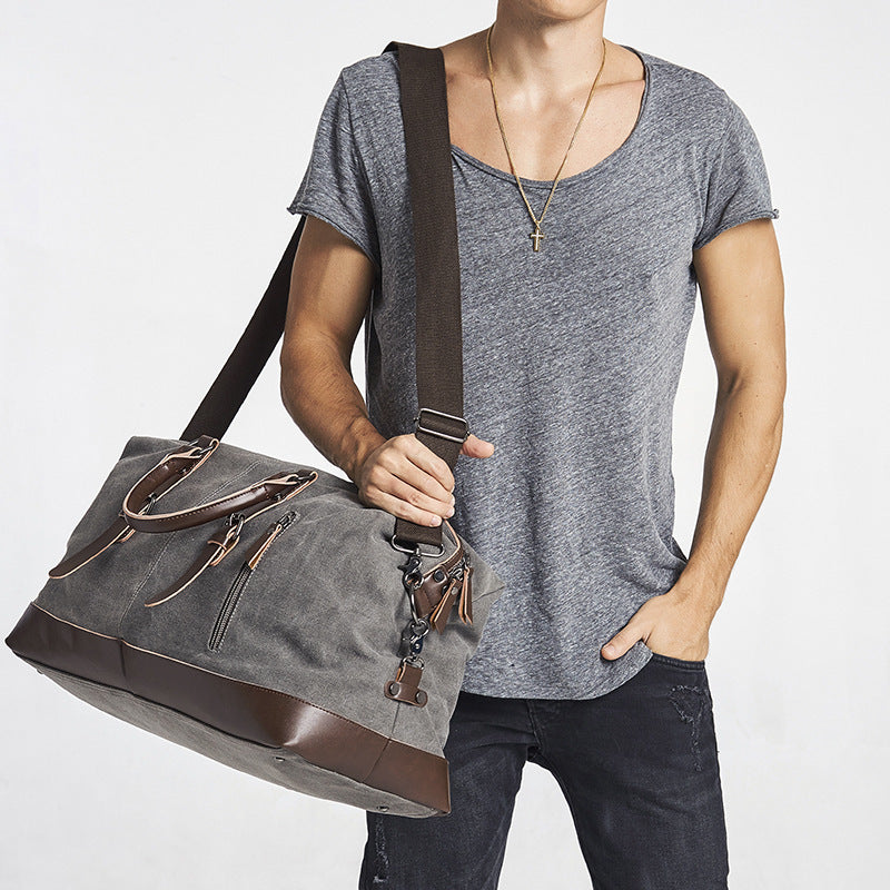 Spacious Canvas and Leather Travel Bag with Adjustable Shoulder Strap